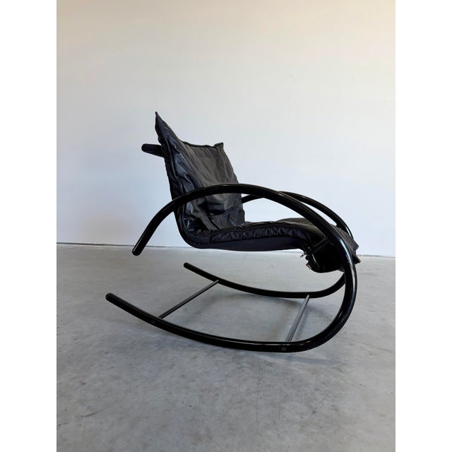 Vintage Post Modern Memphis Style Rocking Chair attributed to Les Amisco Canada. Circa 1980’s, black tubular metal ellipse...