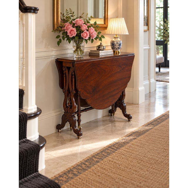 A superb antique Victorian rosewood drop leaf table, traditionally known as a Sutherland table, dating to circa 1850. Made...