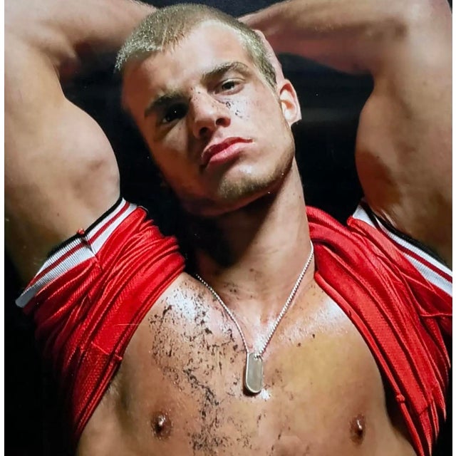 This evocative contemporary photograph captures a moment of intense athletic struggle, rendered with a dramatic, high-...