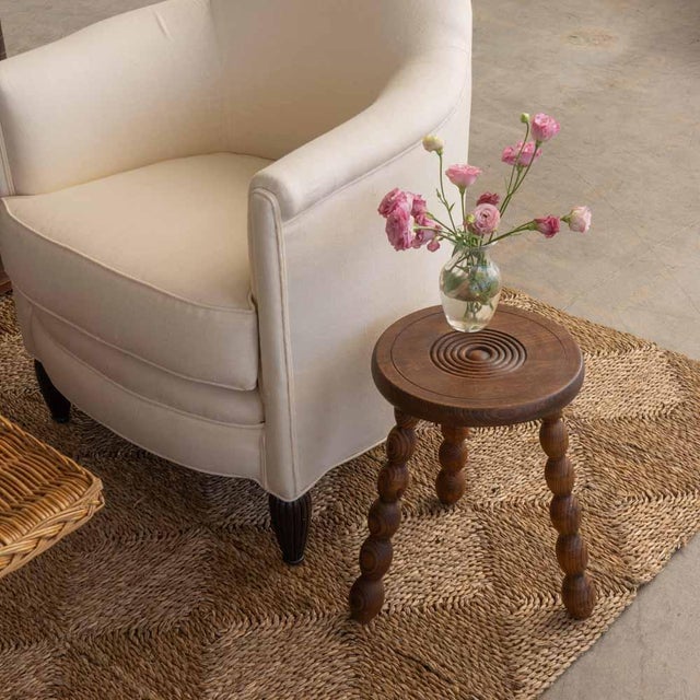 Lovely vintage stool with circular seat and bobbin tripod legs from France. Circular seat has beautiful carved ring detail...