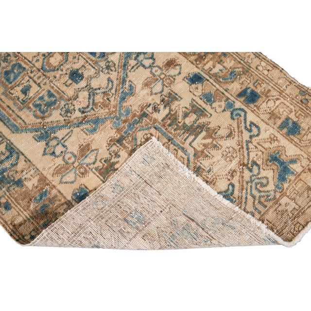 Beautiful Vintage Persian Heriz Hand knotted Wool Rug a Beige field. This piece has a subtle blue and green accents...
