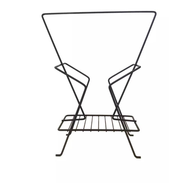 we have for your consideration a very beautiful 1950s atomic magazine rack designed by Richard galef.magazine rack...