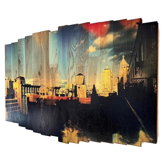Soaring sky high, part of the “wooden postcards” series, lifts the viewer above union square’s rooftops, capturing new...