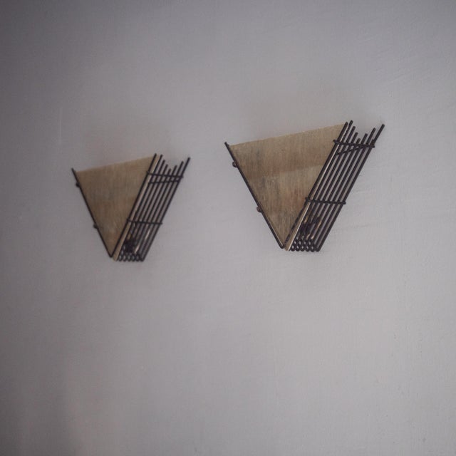 Rare pair of fan-shaped wall lamps. Painted metal frame and fiberglass diffuser. Stunning minimalist design. Up to 250V...