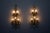 Two imposing pairs of crystal and gilt wrought iron wall lights, giovanni banci, italy, 1970s. Each light fixture is...