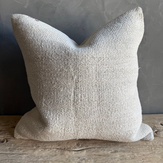 Creamy white hemp rug pillow with original seams. Soft hand, linen blend backing with zipper closure. Spot cleaning is...