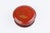 A charming antique Chinese red lacquer box of circular form, the lid finely hand-decorated in gold with a goldfish among...