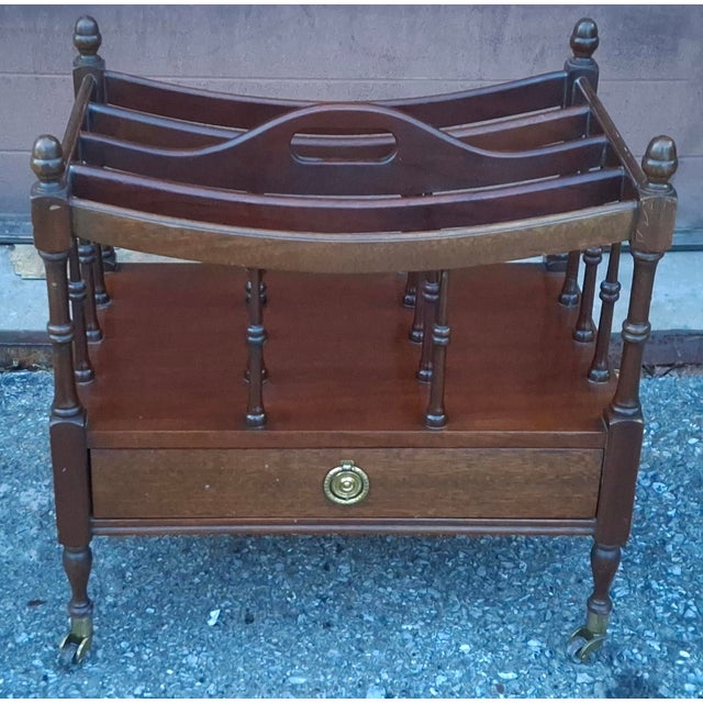 English Regency Style Mahogany and Brass Rolling Canterbury. Measures 19" in width x 13" in depth and 19" in height.