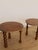 An unusual pair of burlwood drinks tables featuring round tops with brass banding and distinctive turned legs. The warm...