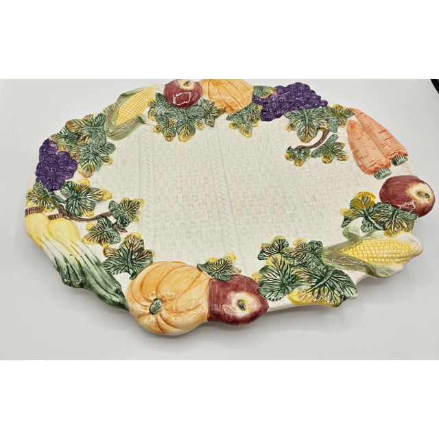 Add a vibrant touch of vintage charm to your table with this stunning Fitz & Floyd “Omnibus” serving platter from 1995....