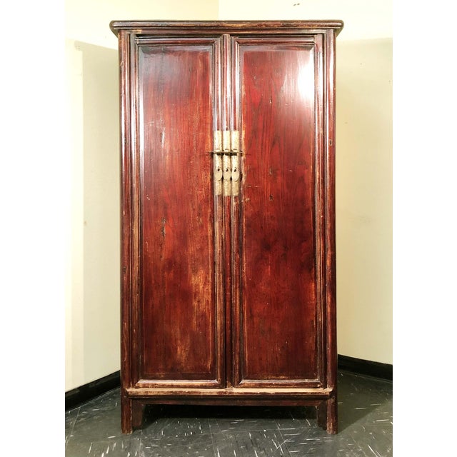 This antique Chinese Ming cabinet is handcrafted in an elegant Ming style. All the frames of the cabinet are carved with...