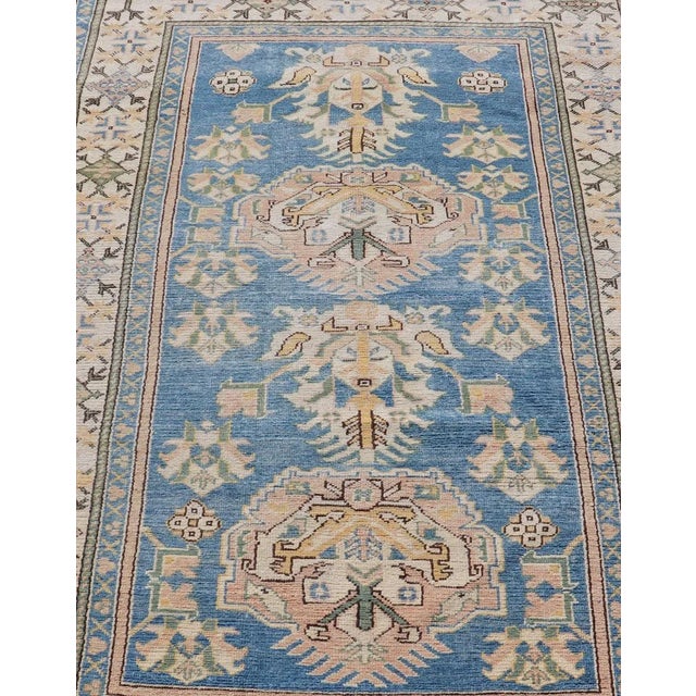 Measures: 4'8 x 7'2 Vintage Turkish Oushak Rug with Large Medallion Design On A Blue Field. Keivan Woven Arts/rug...