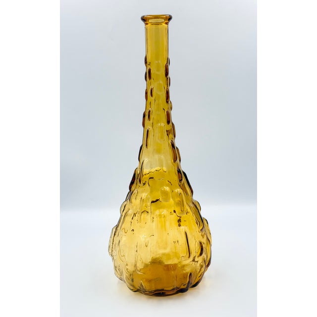 Vintage Italian Empoli amber glass genie bottles missing their original stoppers function beautifully as retro bud vases,...