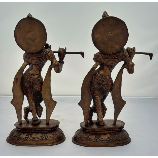 Pair of brass standing figure of a Krishna playing musical instrument. Overall nicely aged original color patina. India,...