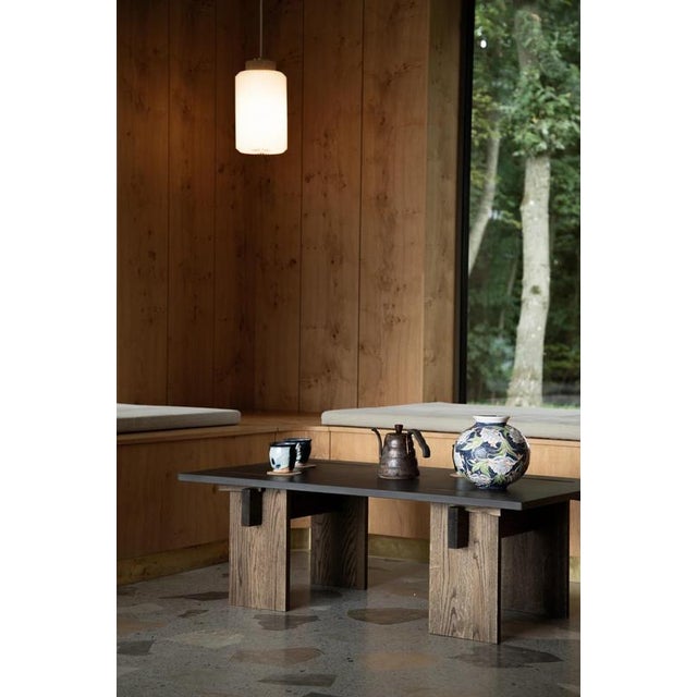 Arnold Dark Concrete Top and Dark Oak Legs Coffee Table by Eberhart Furniture Dimensions: D 110 x W 65 x H 38 cm....
