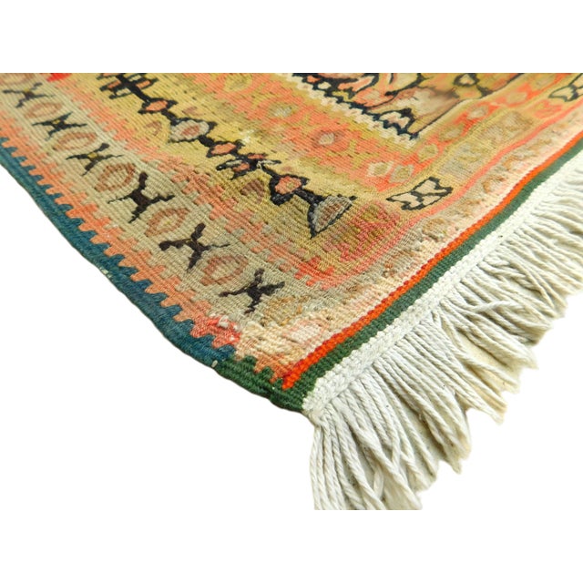 A rare antique Persian Senneh kilim with unusual medallion surrounded with floral decoration. Flat woven with hand spun...