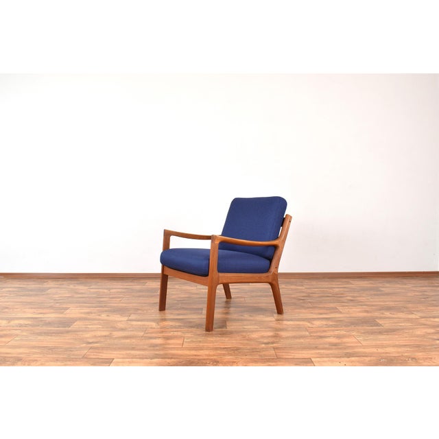 This armchair model Senator was designed in the 1950s by Ole Wanscher and manufactured by Cado. The armchair frame is made...