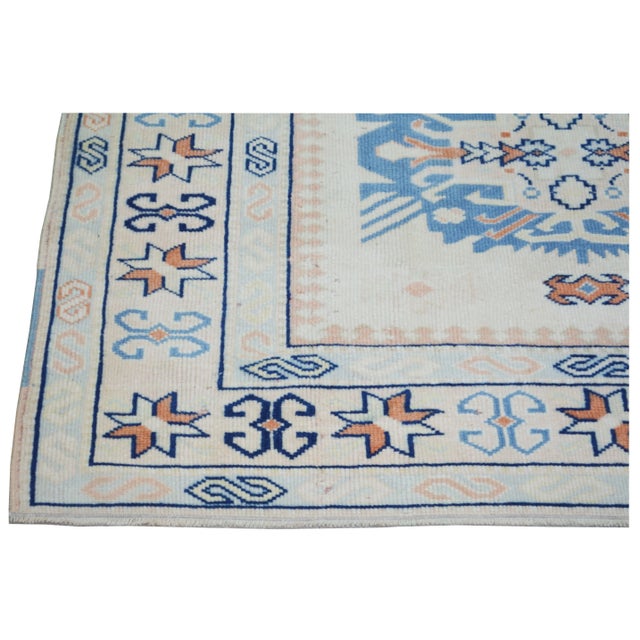 Hand-knotted with care using traditional rug making techniques, this wool rug blends timeless craftsmanship with a modern...