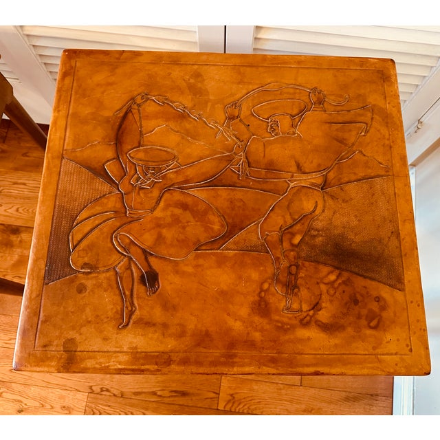 Vintage Peruvian leather top wooden nesting tables with intricate designs. Made by Estudio Taller-Corongo Lima, Peru....