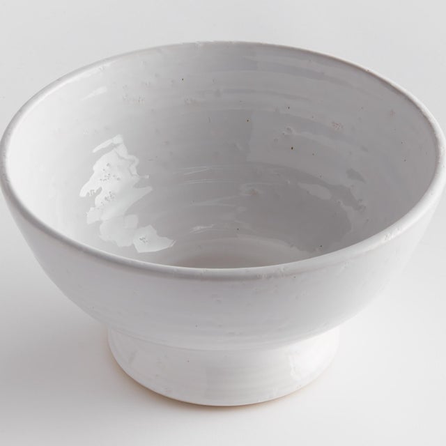 Subtle throw lines and natural textures from the firing process give this terracotta bowl a vintage look. Finished in a...