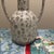 Drawing inspiration from ancient Greek amphora forms, this piece features a timeless silhouette with two slender, elegant...