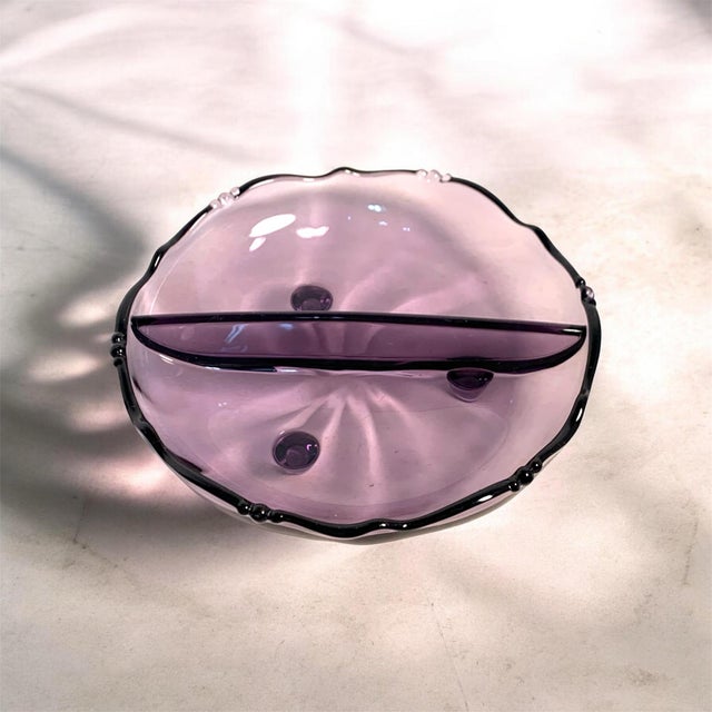 This listing is for a charming mid-century divided glass dish in a soft purple hue, featuring a scalloped rim, delicate...