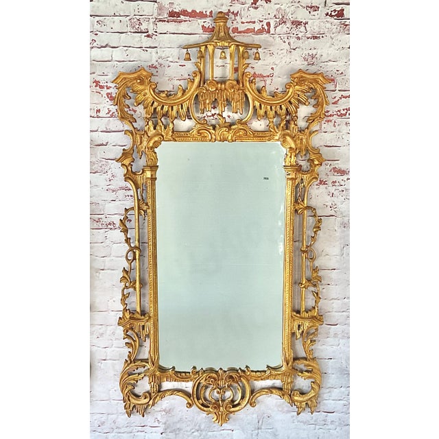 LaBarge Chinese Chippendale–style Chinoiserie wall mirror, crafted in Italy during the 20th century. With its soaring...