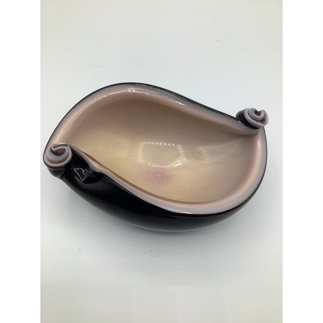 A stunning Italian 1950s Alfredo Barbini cased glass ashtray/bowl pink aventurine with black and swirled ends. The color...