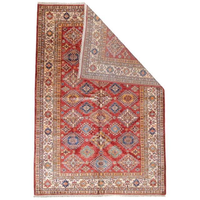 PAK Kazak Rug 5'7'' x 8'2''. Pakistani post-WWII rug, generally scatters, with soft wool and curvilinear Persianate...