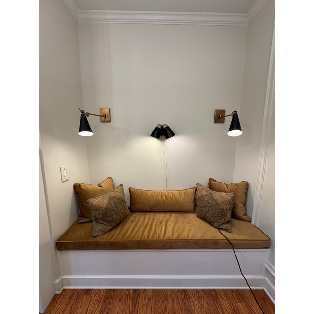 A Mid-Century Modern style strongly inspired by Sesrge Mouille with a European modernist flair adorn this double cone...