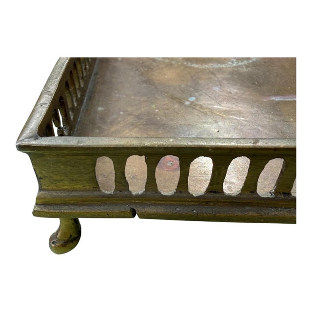 Elegant vintage brass gallery tray featuring pierced oval fretwork sides, petite ball feet, and a beautifully aged patina...