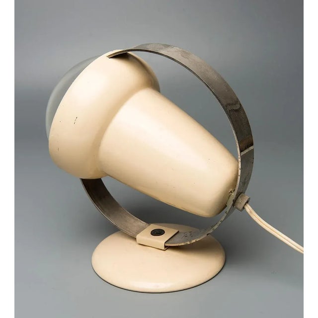 This desk lamp was designed by Charlotte Perriand for Philips. Up to 250V (Europe/UK Standard).The wiring of this item may...