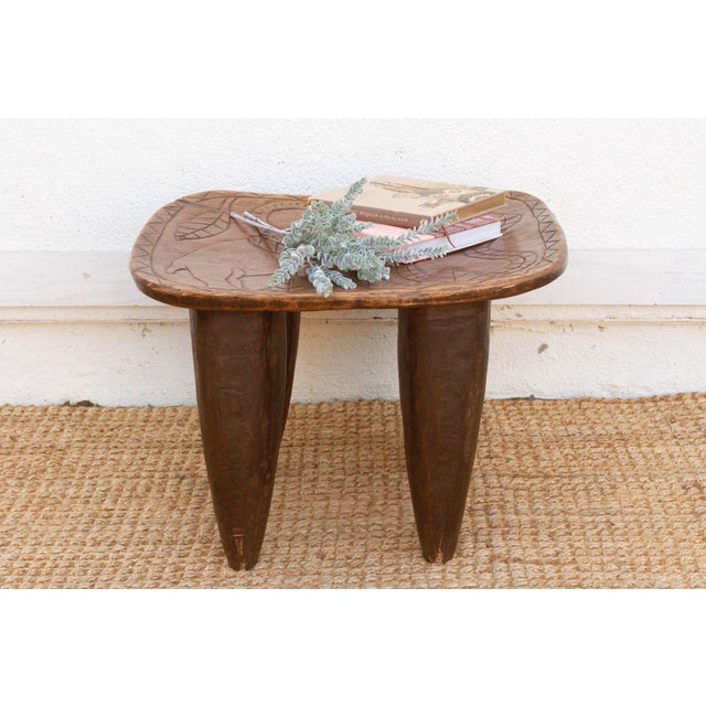 This charming 24-inch stool is an authentic piece of functional art from the Senufo people of the Ivory Coast. In Senufo...