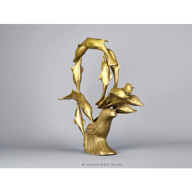 Large Solid Brass Dolphin Sculpture This stunning sculpture is made from solid brass. It shows natural patina from the age...