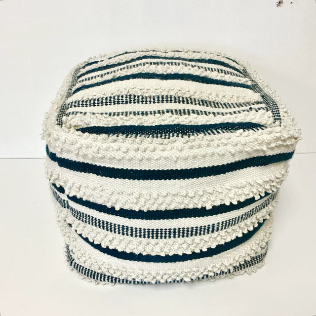 This Kilim Footstool with its Navy and Off-White design gives it both a Boho Chic and Coastal style. It’s a great accent...