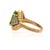 A vintage 6 carat oval natural peridot and 0.35 carat round brilliant diamond pave 14K yellow gold cocktail ring,...