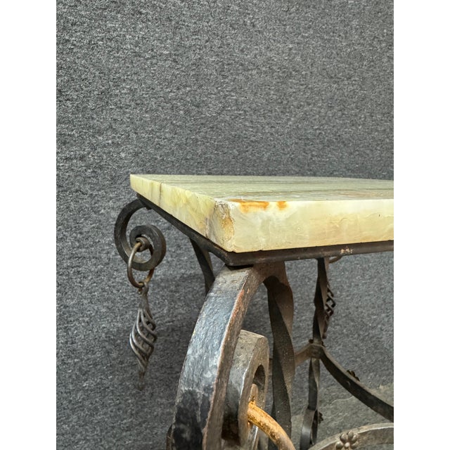 Black iron base Victorian pedestal/plant stand with light marble top, featuring hues of green, white, brown and orange....