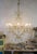 Large empire style chandelier in golden metal, illuminated by 8 lights e12 (us wiring). Chandelier with a very large...