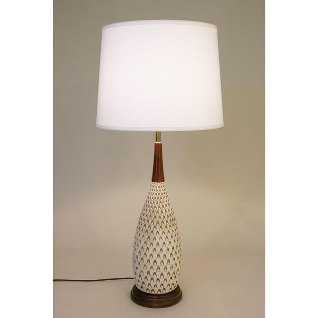 A dynamic yet elegant large relief design glazed ceramic pottery table lamp design produced by Raymor ceramics in Italy...