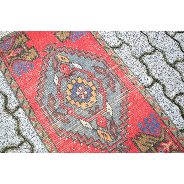 This is a vintage Turkish Oushak rug from the 1960s. The piece was hand-knotted.