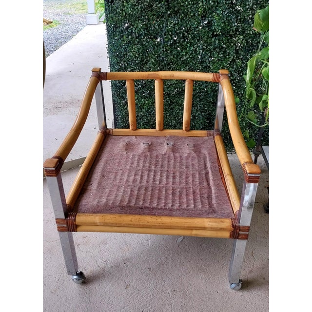 Unusual bamboo and chrome, mid century loungers. On wheels, slightly low to the ground with white vinyl cushions. Cushions...