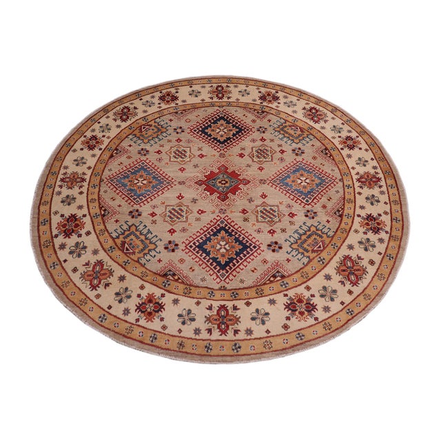 Enhance your home with this exquisite hand-knotted Kazak rug, crafted from fine hand-spun wool and dyed with all-natural...