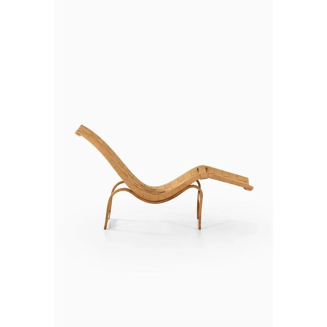 Rare early lounge chair designed by Bruno Mathsson. Produced by Karl Mathsson in Värnamo, Sweden. This piece is attributed...
