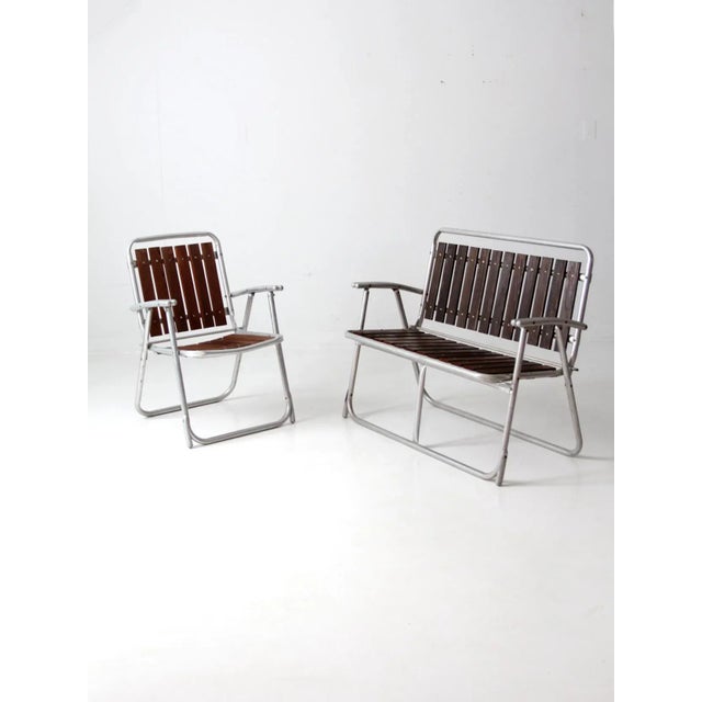 Relax in style with this beautiful mid-20th century vintage patio chair and loveseat set. Crafted with an aluminum frame...