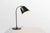 A characterful 1920s French industrial desk lamp in metal, embodying the utilitarian elegance of early 20th‑century...