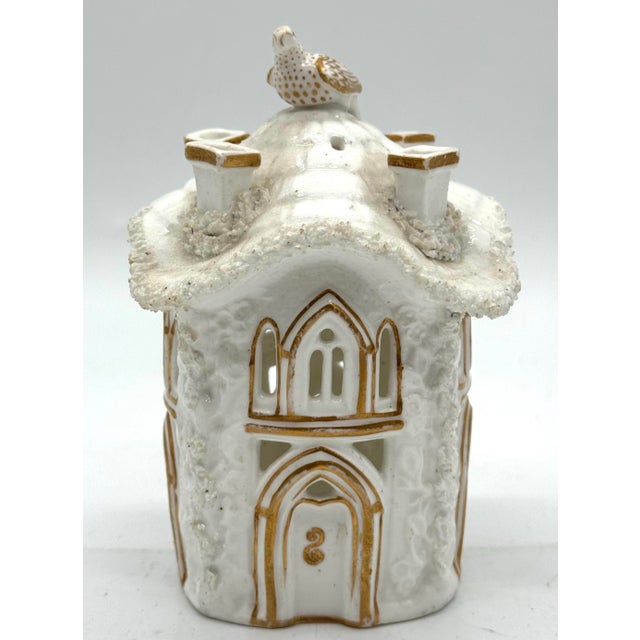 Antique English Staffordshire cottage pastille burner, detailed with a bird perched on the roof, pierced openings, and...