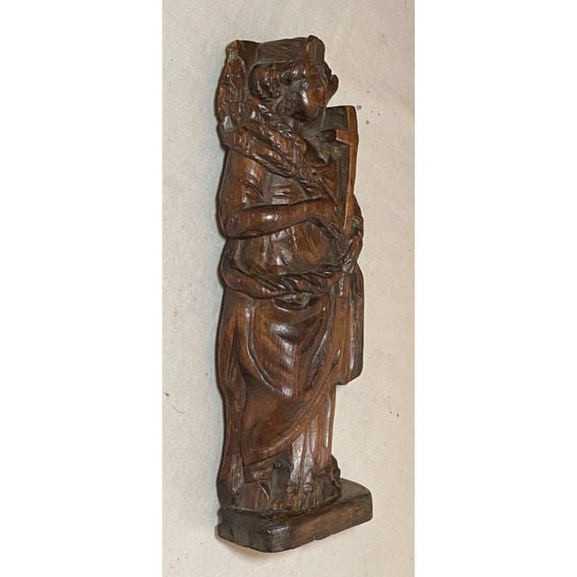This beautiful antique sculpture is a stunning piece of 18th century religious artistry. Crafted from wood, the figure...