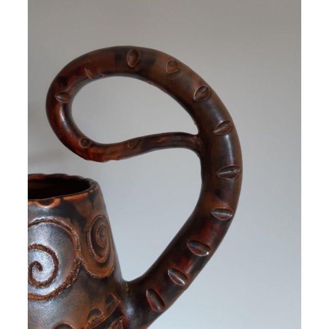 Huguette Bessone. Ceramic zoomorphic pitcher. Majestic pitcher with scarified decoration and wide free-form handle....