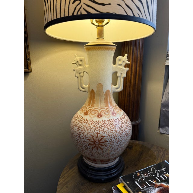 An elegant pair of vintage porcelain table lamps featuring beautifully proportioned baluster-form bodies finished in a...