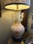 An elegant pair of vintage porcelain table lamps featuring beautifully proportioned baluster-form bodies finished in a...